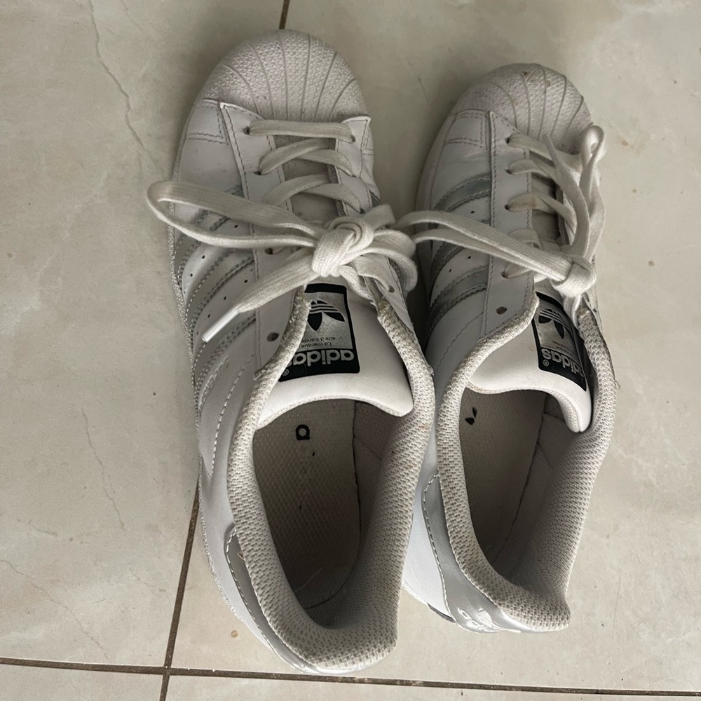 White with silver stripe Adidas sneakers